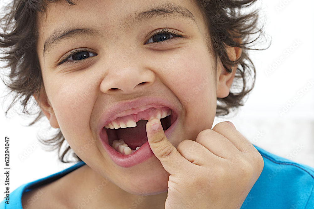 Child boy hand pointing his baby milk teeth fall out Stock Photo