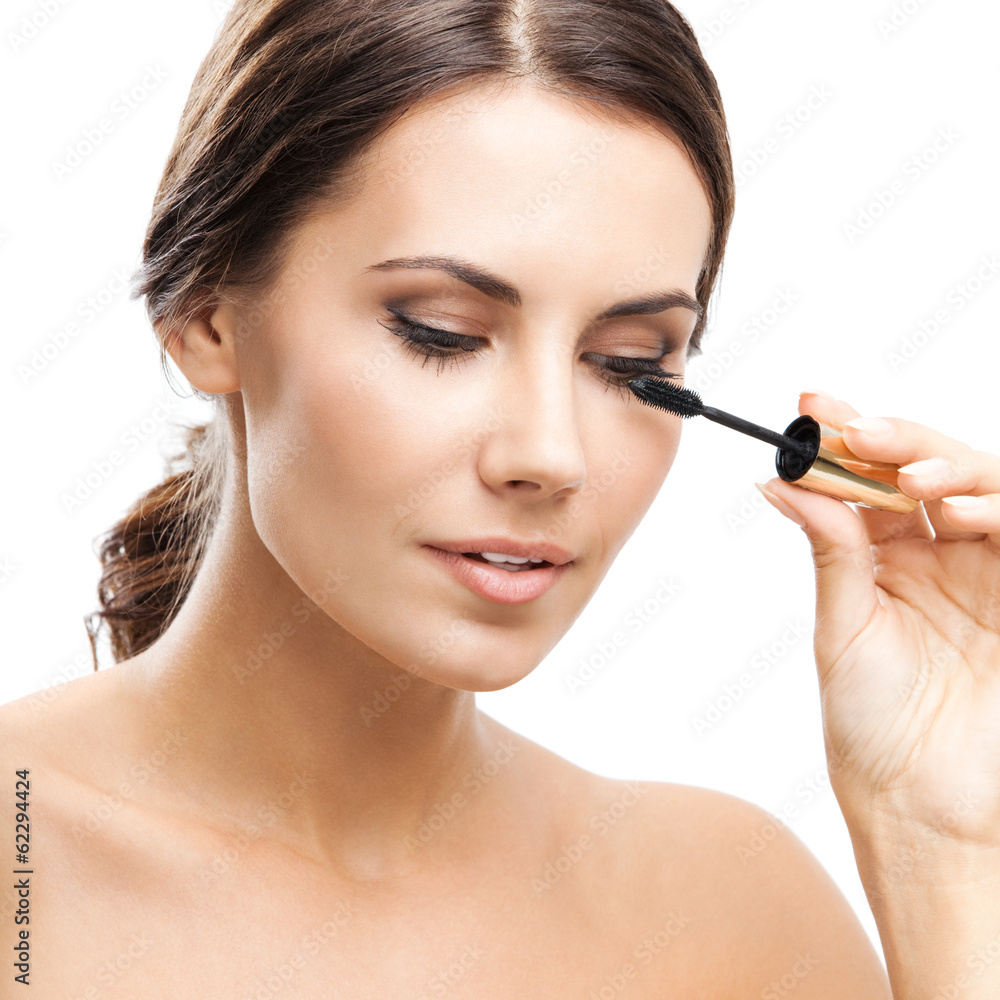 Young woman with cosmetics brush, isolated Young woman with cosmetics brush, isolated