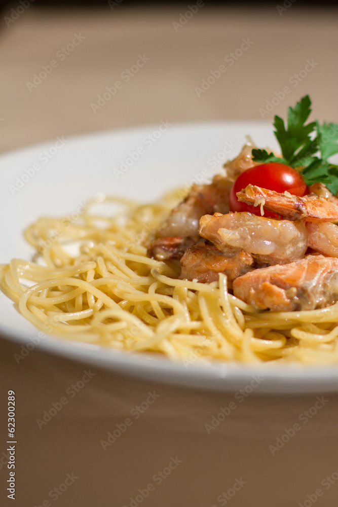 Image of tasty pasta with salmon and herbs