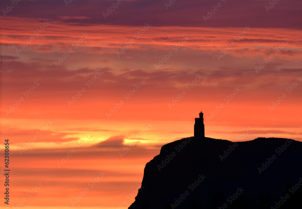 Sunset sky with Milner Tower on Brada Head, Isle of Man, UK