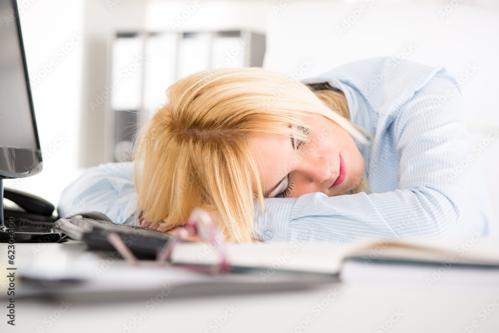 © milanmarkovic78 - Businesswoman sleeping in the office. © milanmarkovic78 - Businesswoman sleeping in the office.