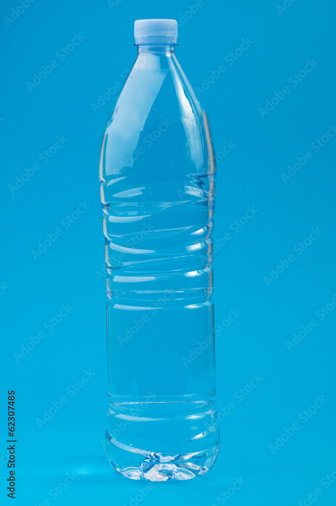 Transparent plastic bottle on a blue background Transparent plastic bottle on a blue background