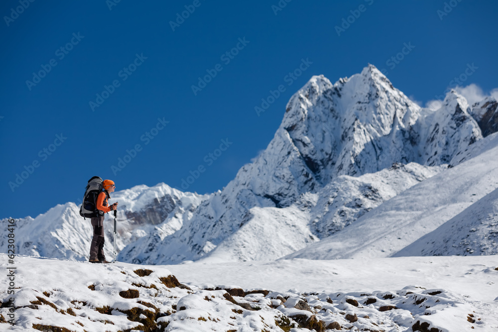 Hiker walks on train in Himalayas Hiker walks on train in Himalayas