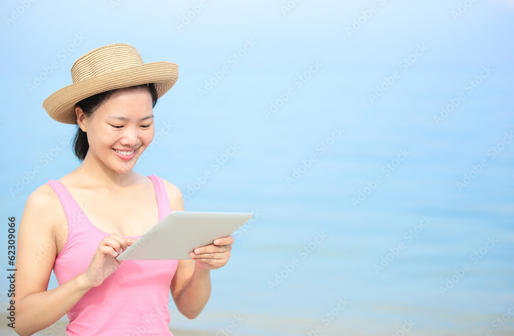 summer holiday woman use digital tablet on seaside beach