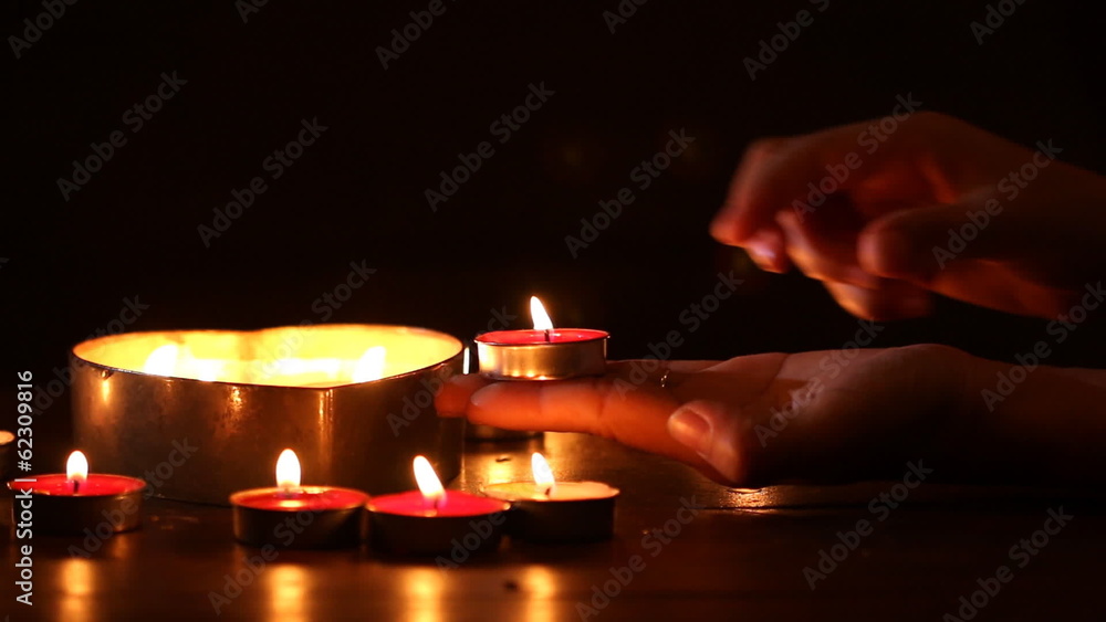 woman hand holding a candle woman hand holding a candle
