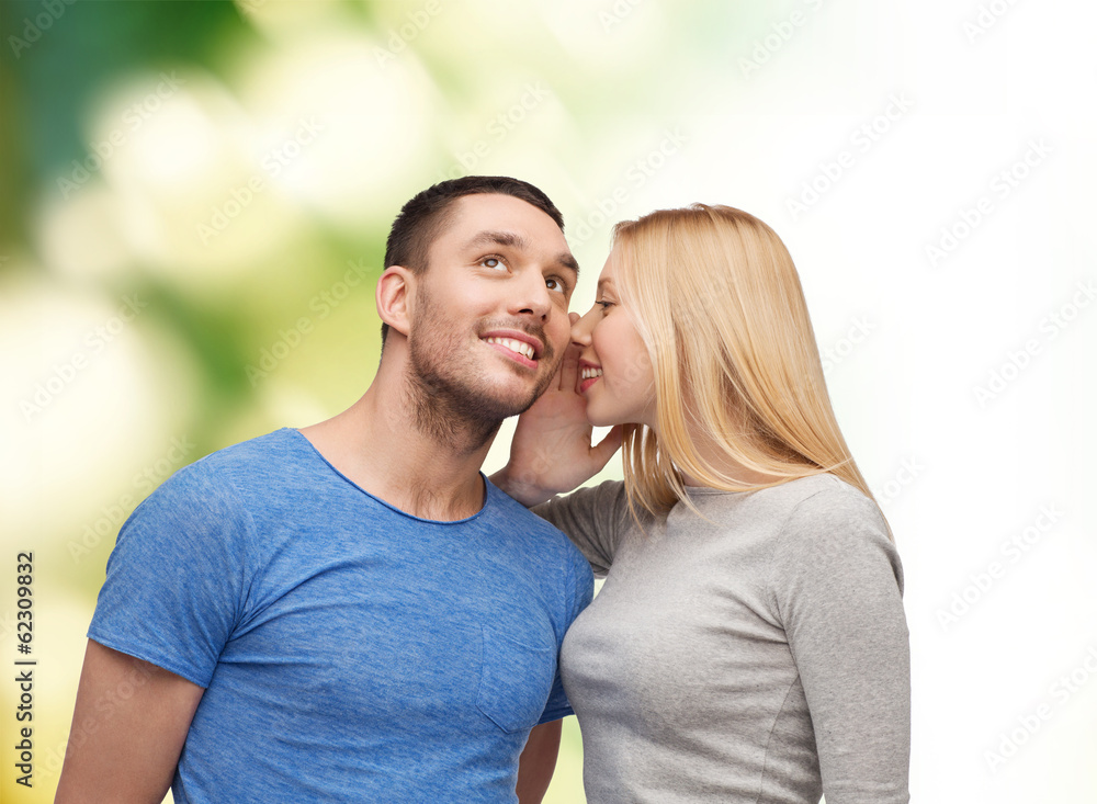 smiling girlfriend telling boyfriend secret smiling girlfriend telling boyfriend secret