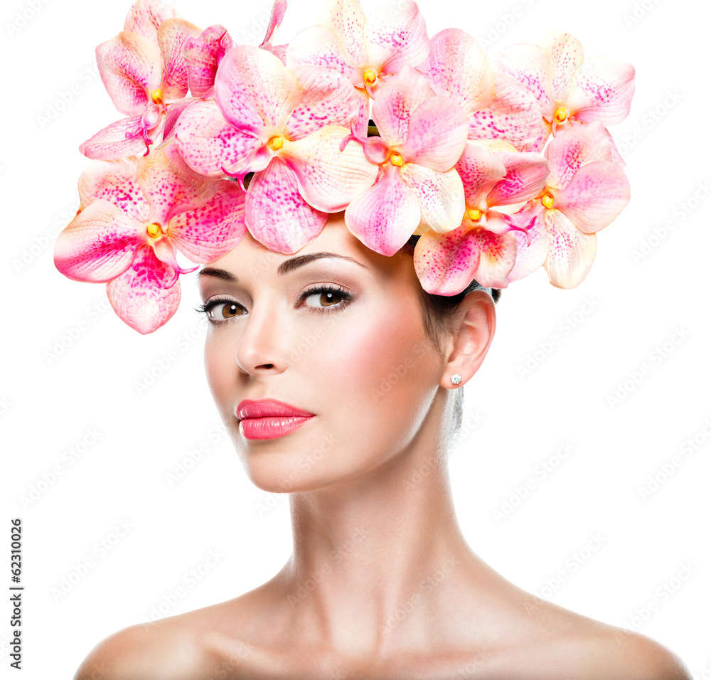 Beautiful face of woman with healthy skin and pink flowers Beautiful face of woman with healthy skin and pink flowers