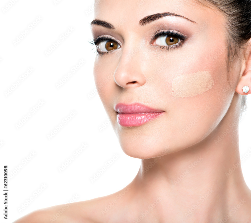 Beautiful face of woman with cosmetic foundation on a skin. Beautiful face of woman with cosmetic foundation on a skin.