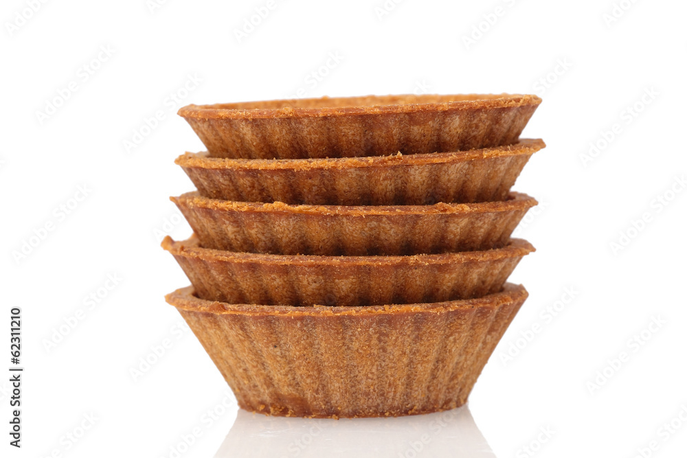 Stack of empty dark tartlets Stack of empty dark tartlets