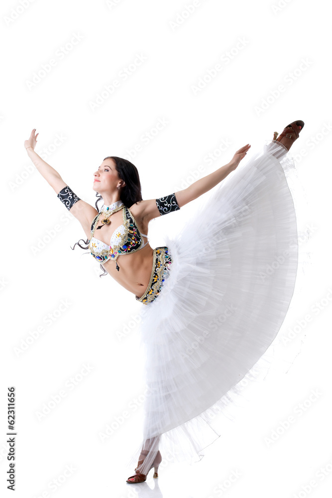 Naklejka premium Smiling belly dancer gracefully posing in studio