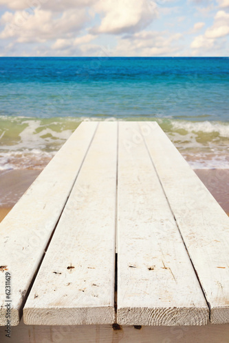 Nautical background with empty wooden deck over sea