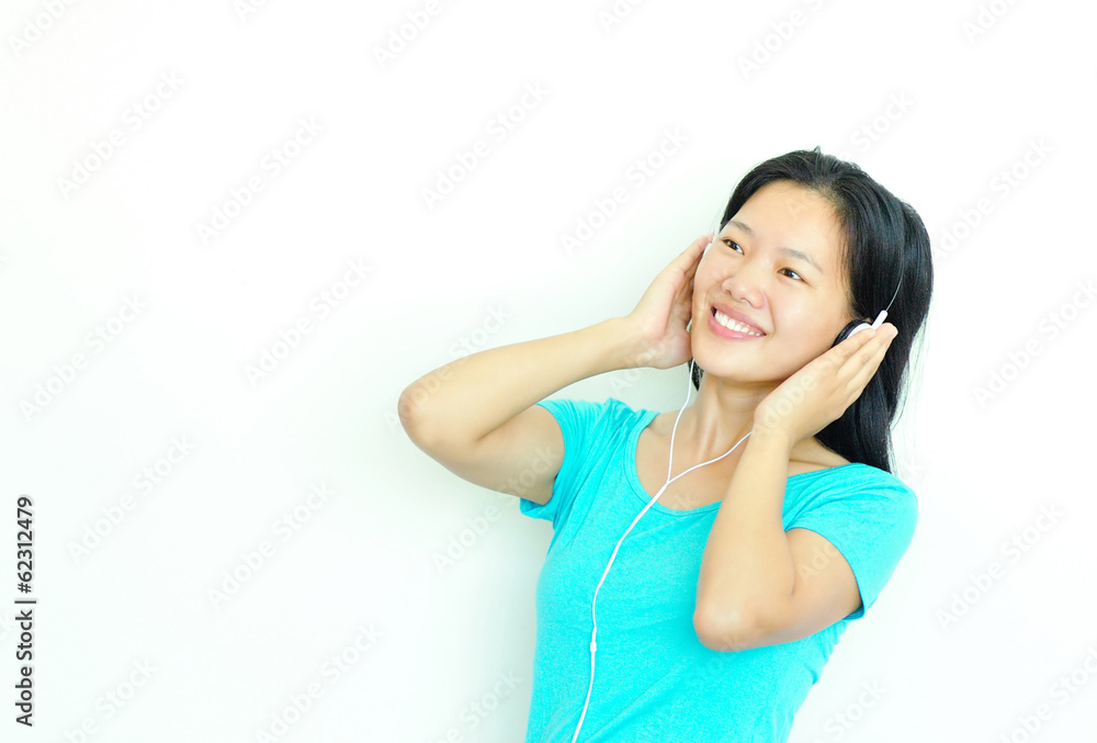 happy beautiful young asian woman enjoying the music happy beautiful young asian woman enjoying the music