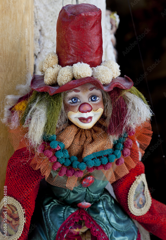 Puppet:colorful clown dressed with clothes.