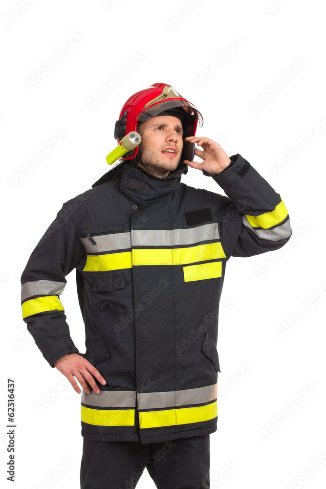 Fireman using phone. Fireman using phone.