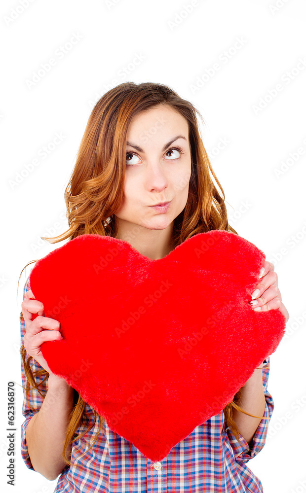 woman holding a toy heart woman holding a toy heart