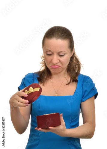 Woman disappointed after opening gift, white background