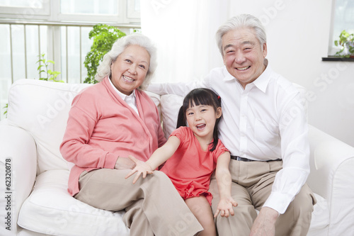 .Senior couple with granddaughter. © eastfenceimage