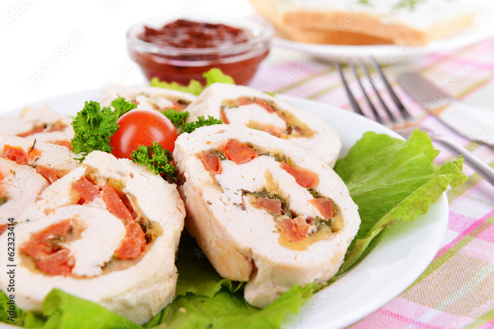Delicious chicken roll on plate on table close-up Delicious chicken roll on plate on table close-up