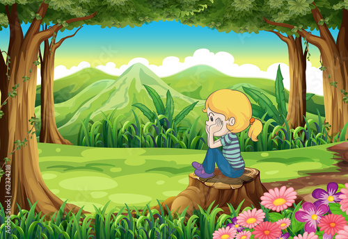 A sad girl sitting above the stump at the forest