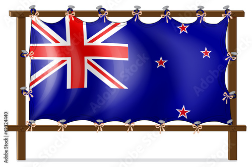 The flag of New Zealand tied to a wooden frame