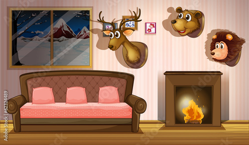 A living room with stuffed head decorations