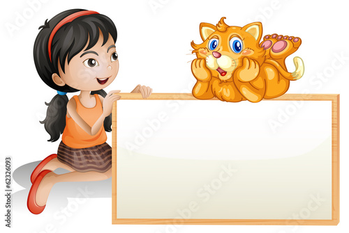 A young girl holding the empty signboard with a cat