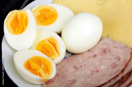 half boiled eggs with ham and cheese