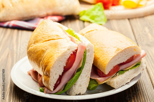 Italian panini sandwich with ham, cheese and tomato