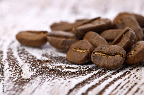 Coffee beans on wood background