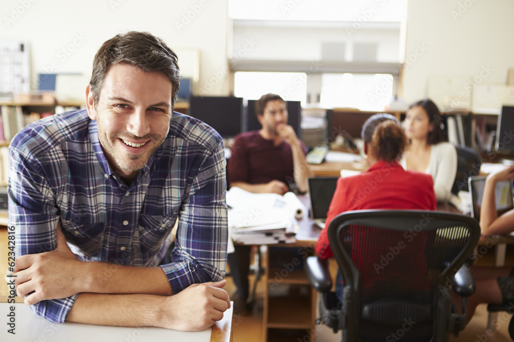 Portrait Of Male Architect With Meeting In Background Portrait Of Male Architect With Meeting In Background