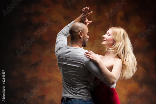Young couple dances Caribbean Salsa
