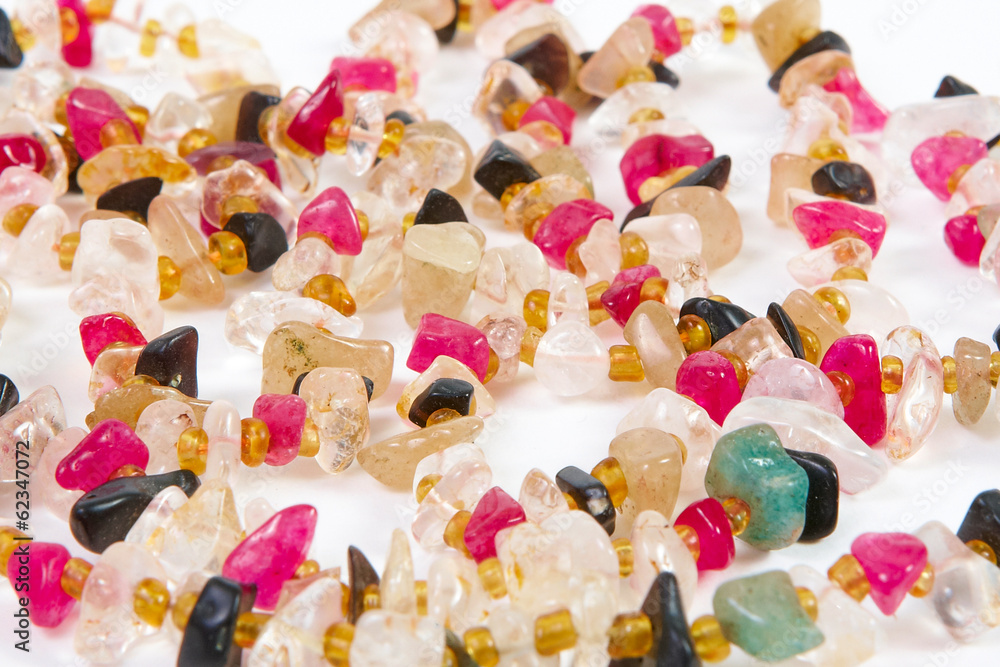 beads of different stones on a white background beads of different stones on a white background