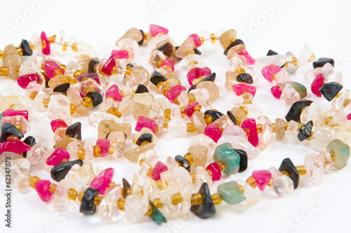 beads of different stones on a white background
