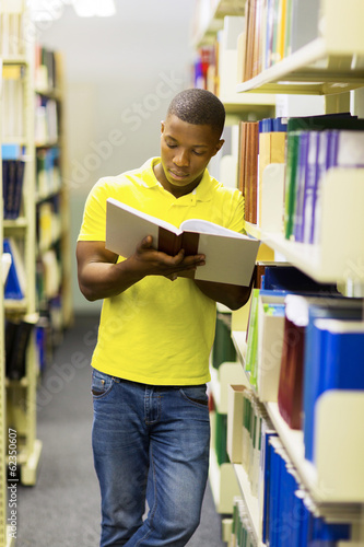 african college boy reading a book