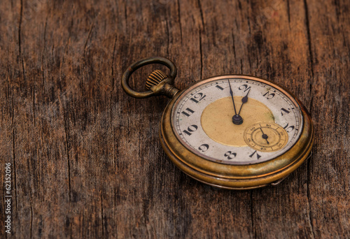 old clock vintage picture in wood background