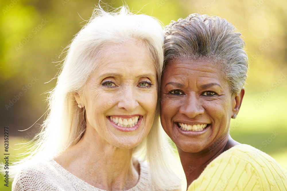 Portrait Of Two Mature Female Friends Hugging Portrait Of Two Mature Female Friends Hugging
