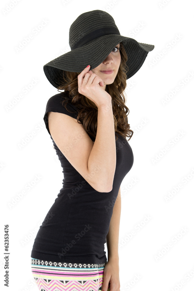 cute bashful female model peering under her black hat cute bashful female model peering under her black hat