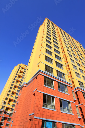 unfinished color building, under the blu sky