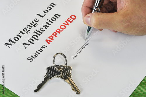 Hand Signing An Approved Real Estate Mortgage Loan Document