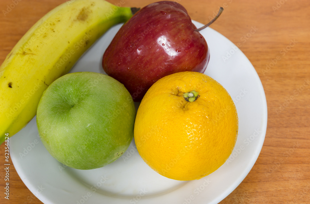 Healthy fruits like banana, oranges and apples Healthy fruits like banana, oranges and apples
