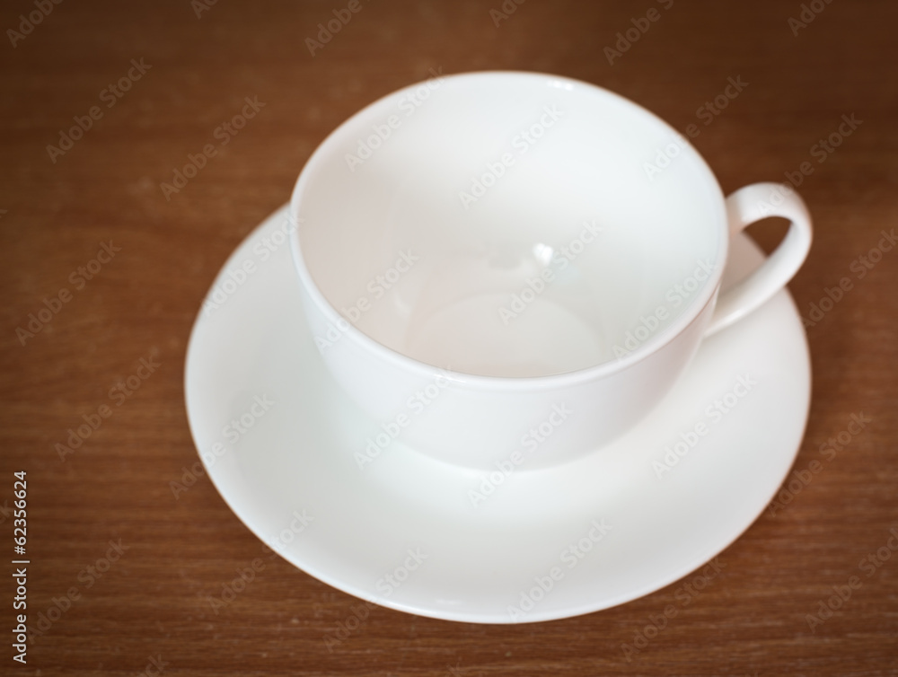 Empty coffee cup on old wooden table. Selective focus. Empty coffee cup on old wooden table. Selective focus.