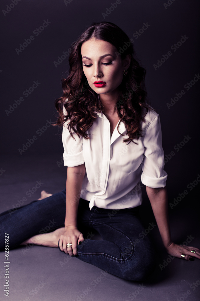 Lovely woman in white blouse and blue jeans Lovely woman in white blouse and blue jeans