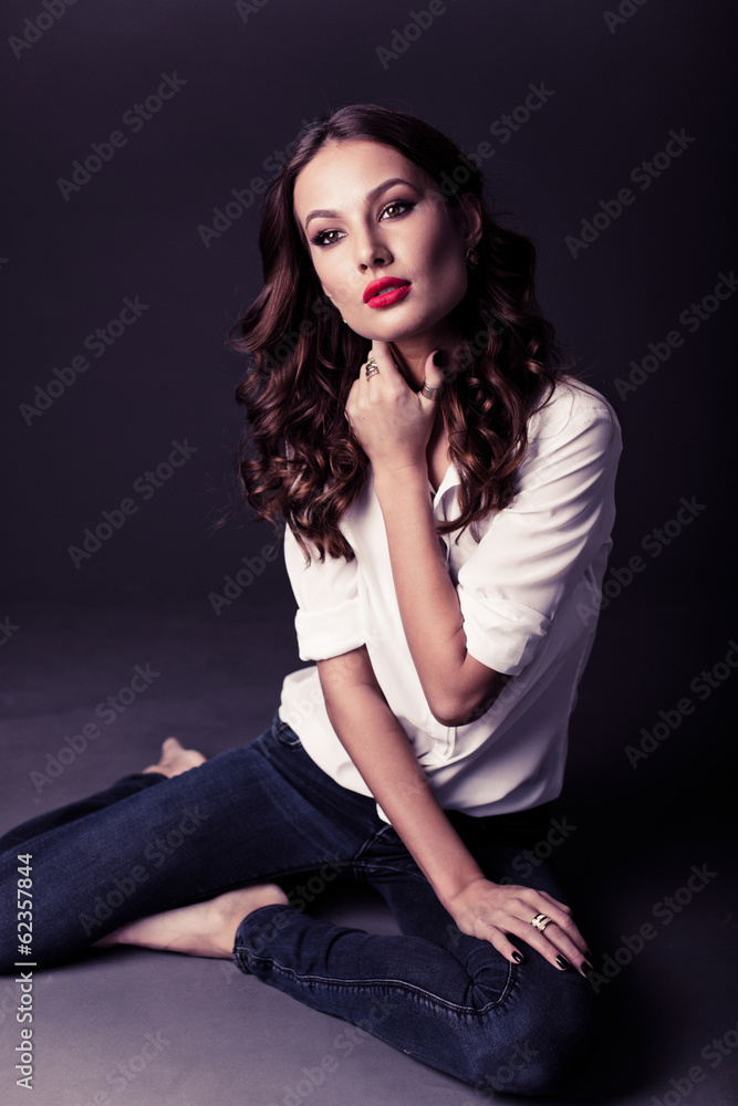 Lovely woman in white blouse and blue jeans Lovely woman in white blouse and blue jeans