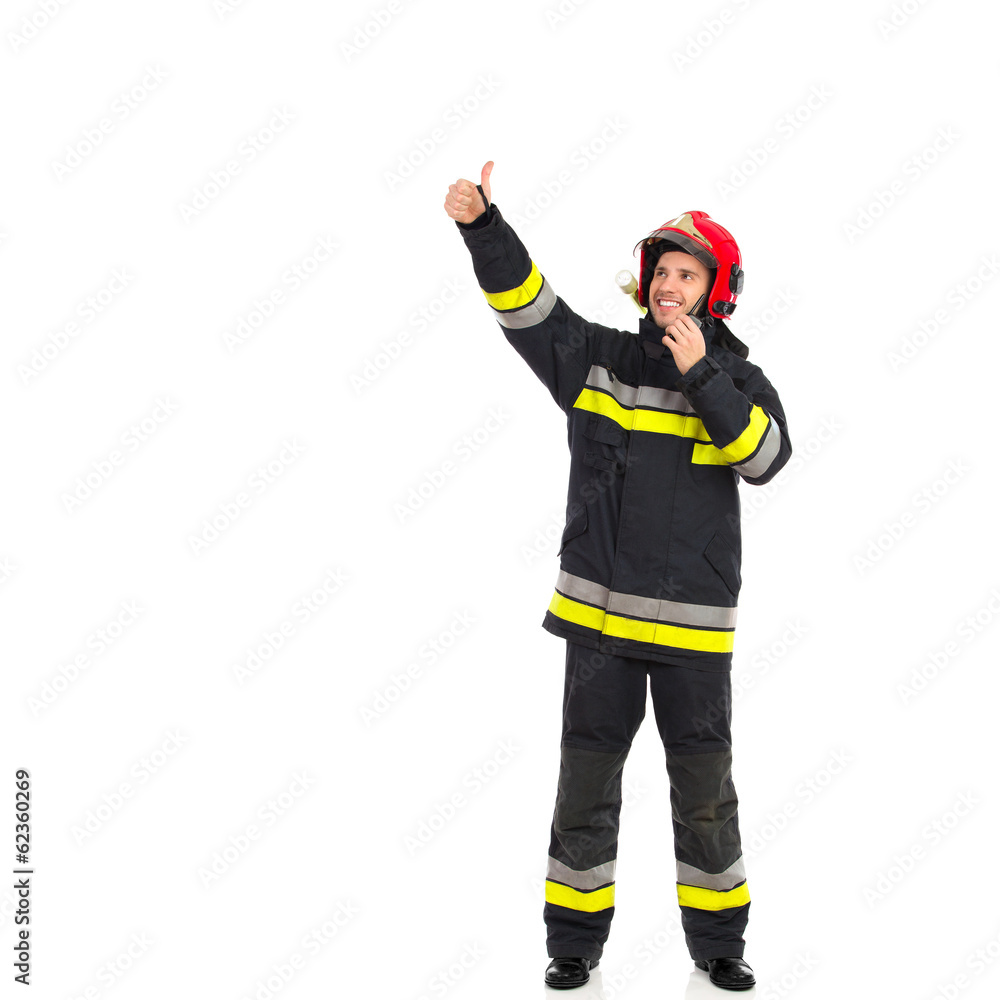 Fototapeta premium Smiling fireman directing