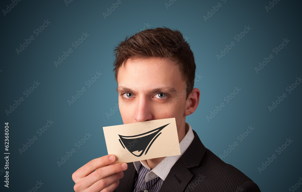 Happy businessman holding funny white card on his mouth