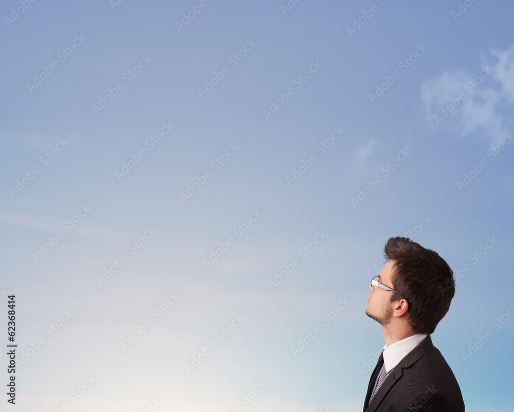Handsome man looking at the blue sky copyspace Handsome man looking at the blue sky copyspace