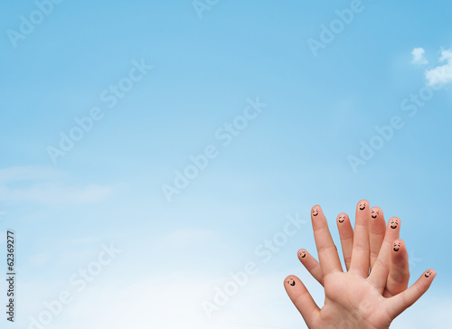 Happy smiley fingers looking at clear blue sky copyspace