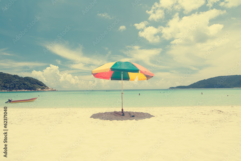 Vintage retro beach with umbrella