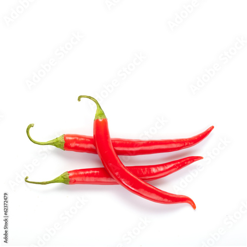 three red hot pepper on a white background