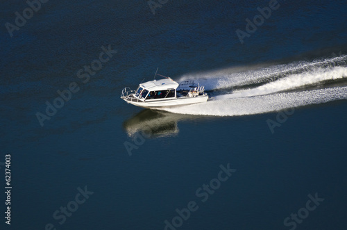 Pleasure Boat Moving Down River © rck